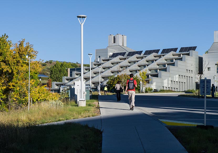 A photo of employees walking to NREL's Solar Energy Research Facility.