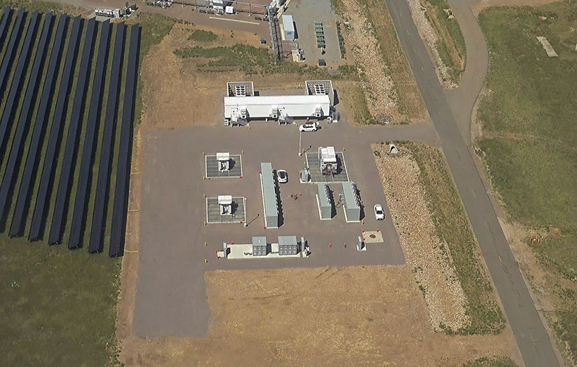 aerial view of Controllable Grid Interface in a lot next to solar panel array