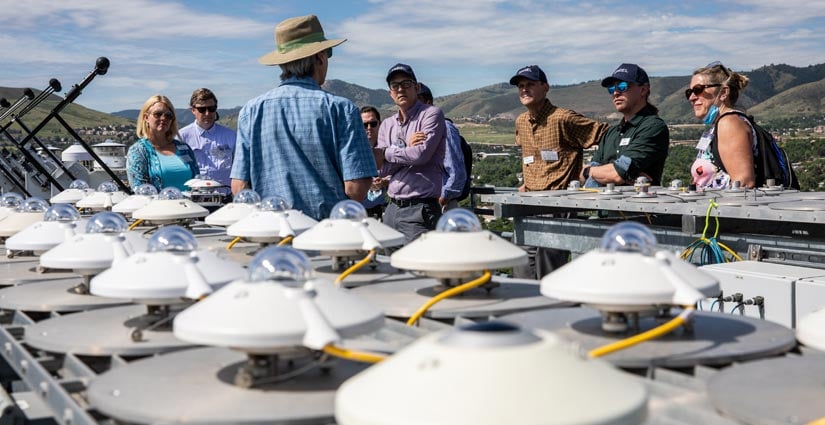 Energy execs view outdoor equipment.