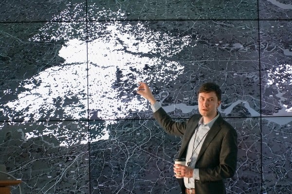 presenter showing data on a map