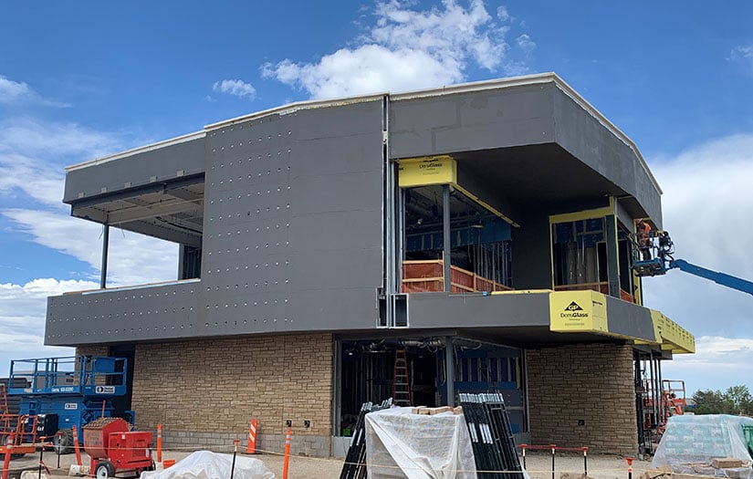 Outside of two-story building under construction.