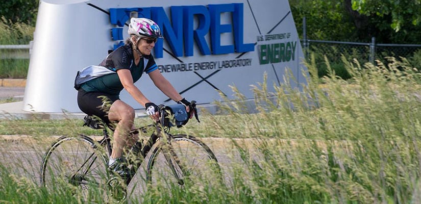 NREL staffer cycles to work.