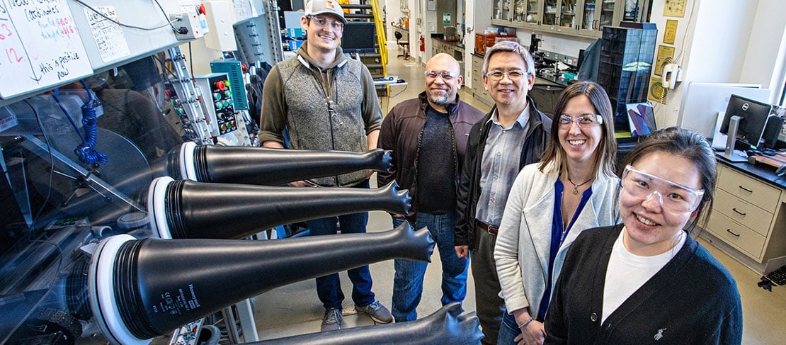 Five researchers in a lab.