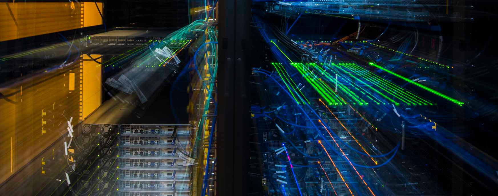 hero-data-storage-45360 Photo of computer server wiring and lights, blurred to show movement.