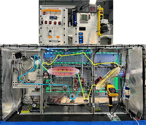 A mechanical set up on a lab bench.