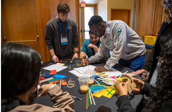 Participants of the 2024 Marine Energy Collegiate Competition designing and building a solar-powered device.