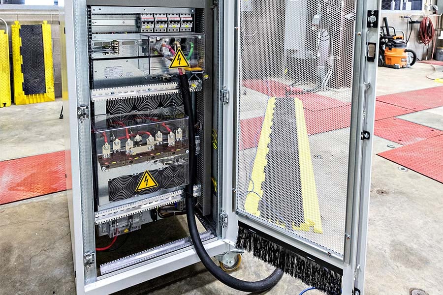 50-kilowatt AC grid emulator with door open to show inner components.