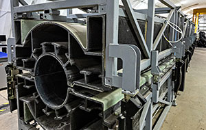 360tour-11-65674 A hollow device that spans a large area of a hangar is supported by a metal frame.