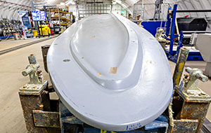 360tour-13-65675 A rounded paddle points toward the camera and stretches away to the back of a hangar.