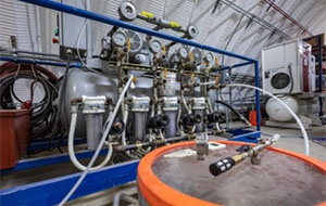 360tour-14-5150 Tanks are interconnected with gauges, wires, and tubes.