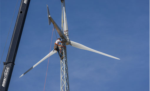 windwatts-wind-turbine Person working on wind turbine