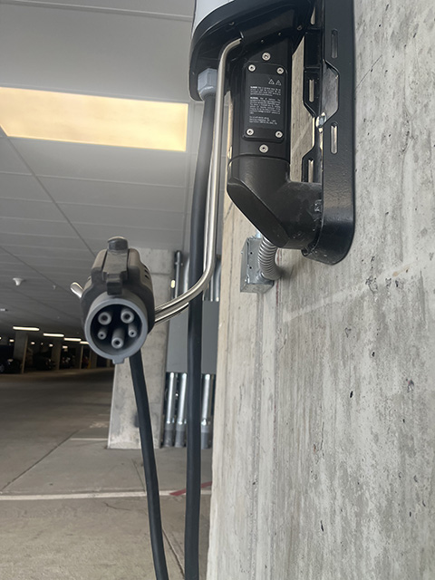 An EV charging station in a parking garage.