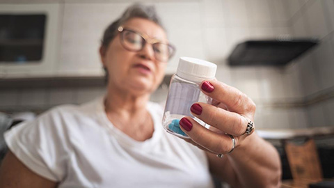 Older Woman with Pill Bottle