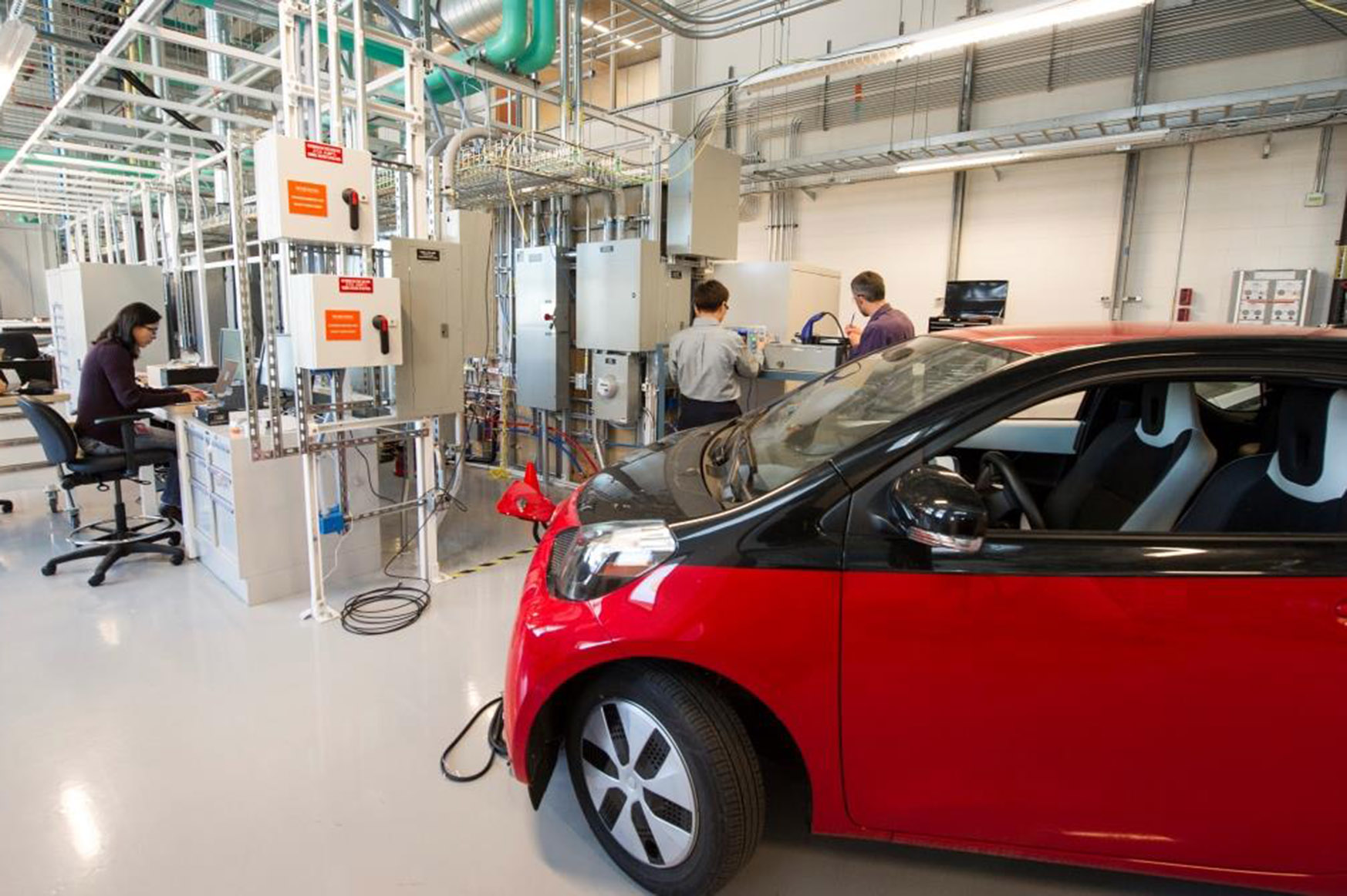 Photo of electric vehicle in laboratory setting.