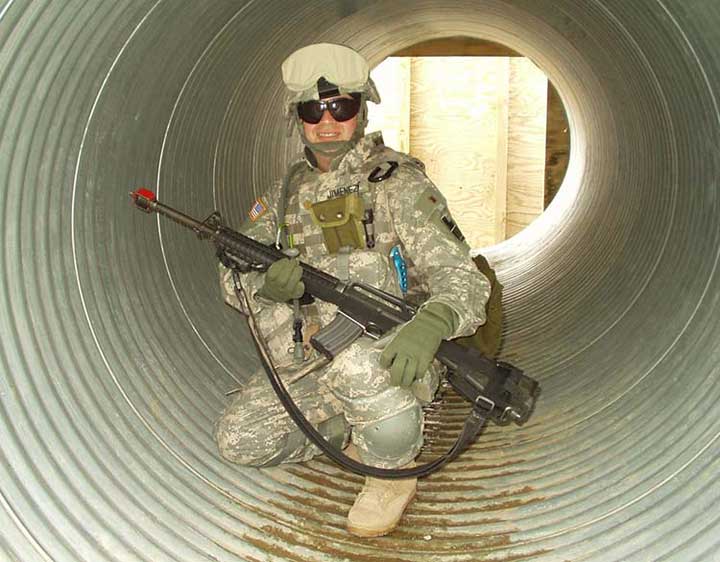 Soldier squats in tunnel