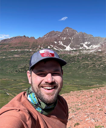 Jeremy Stefak selfie in front of mountains