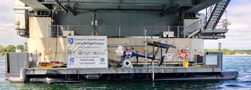 A barge beneath a bridge with research equipment