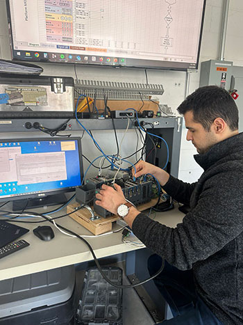 A researcher working on a data at a computer