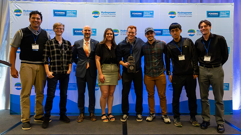 HCC Students stand together for photo while holding an award