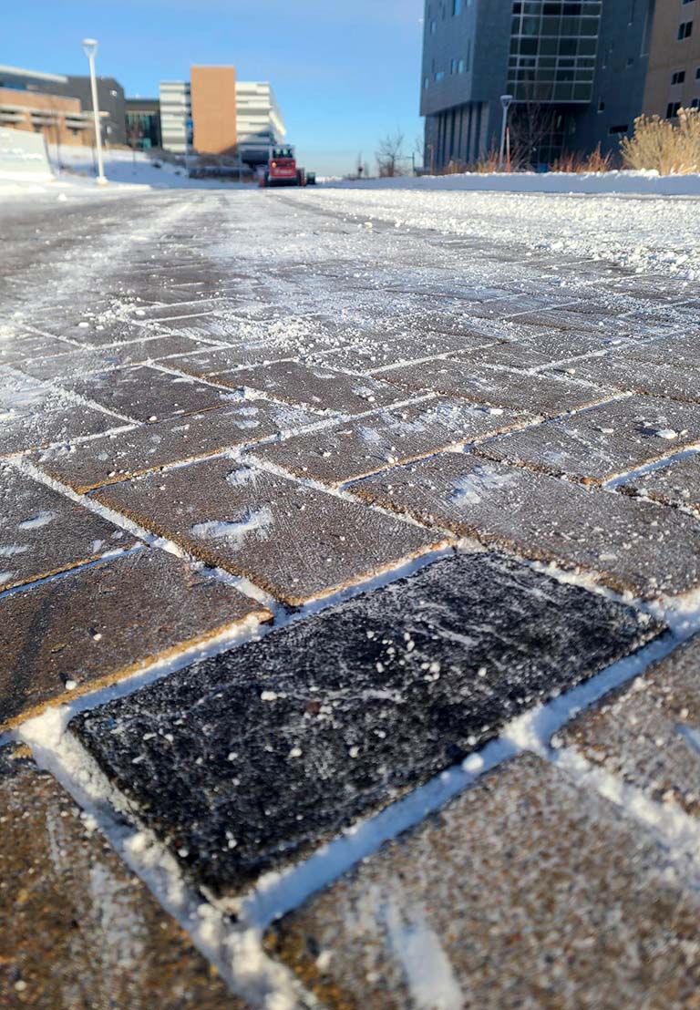 The BUILD’EM paver outside of NREL’s Research Support Facility survived the winter of 2023–2024. Image by Paul Meyer.