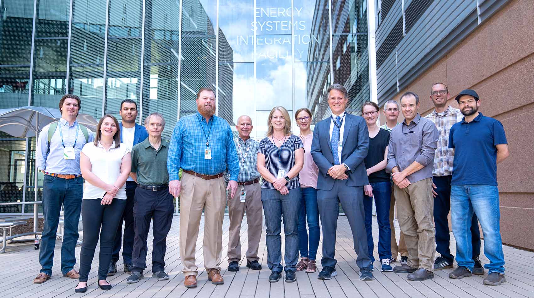 A group of people stand in front of a building