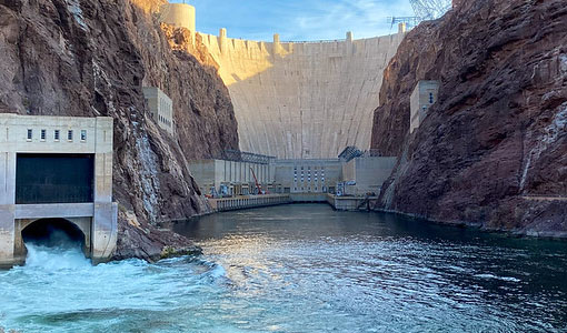 Looking upriver toward the Hoover Dam, with canyon walls on either side and blue sky above