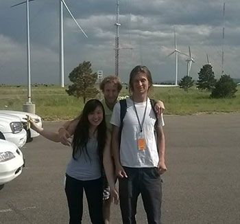 Kelly Huang and two other interns in front of the turbines at the National Wind Technology Center