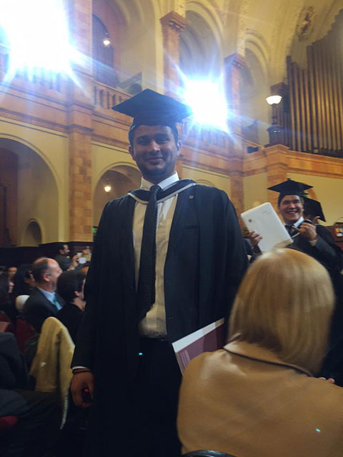 Salman Husain in a graduation cap and gown