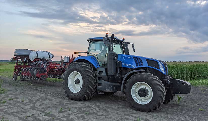 A blue CNH tractor in a field.