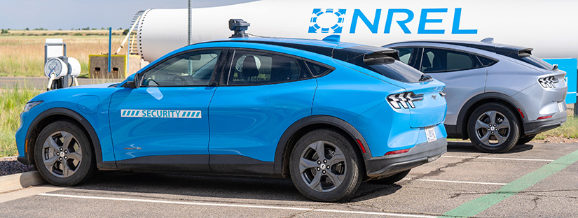 A National Renewable Energy Laboratory Mustang Mach-E4 security vehicle is parked outside the main office at the Flatirons Campus in Arvada, Colorado.