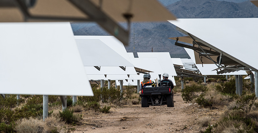 Maintenance workers drive between the heliostats at the Ivanpah concentrating solar energy plant.