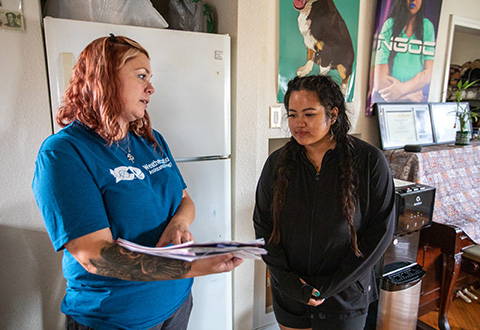 Two women having a conversation.