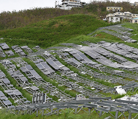 Solar arrays damaged on a field.