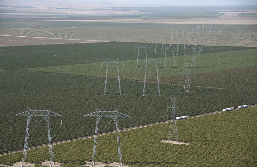 Transmission lines above agricultural fields.