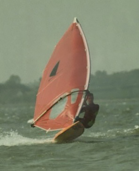 A person windsurfs.