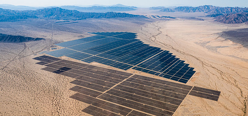 Aerial photo of a solar array in the middle of the desert of California.