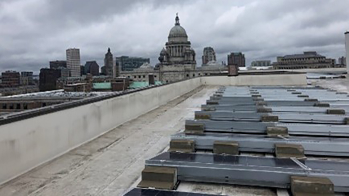 Solar array on top of a downtown building.