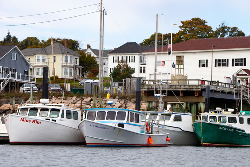 Boats on water in front of buildings.