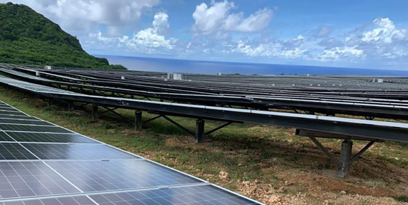 Solar panel arrays on a shoreline.