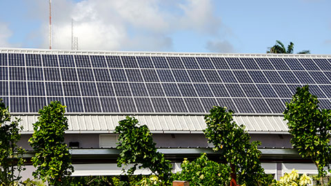 Solar panel array on building rooftop.