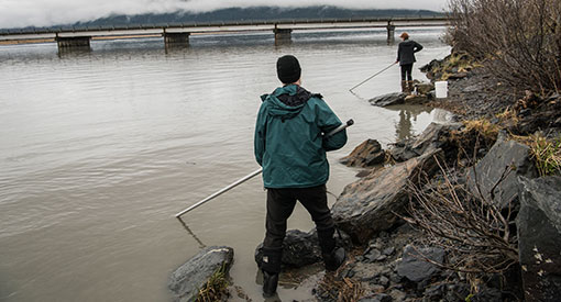 Two people netfishing in Alaska