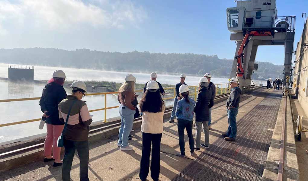 A group tours a hyrdrpower dam.